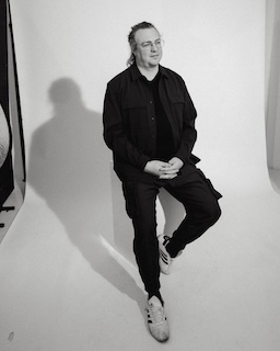 Bob van Luijt sitting on high chair full body